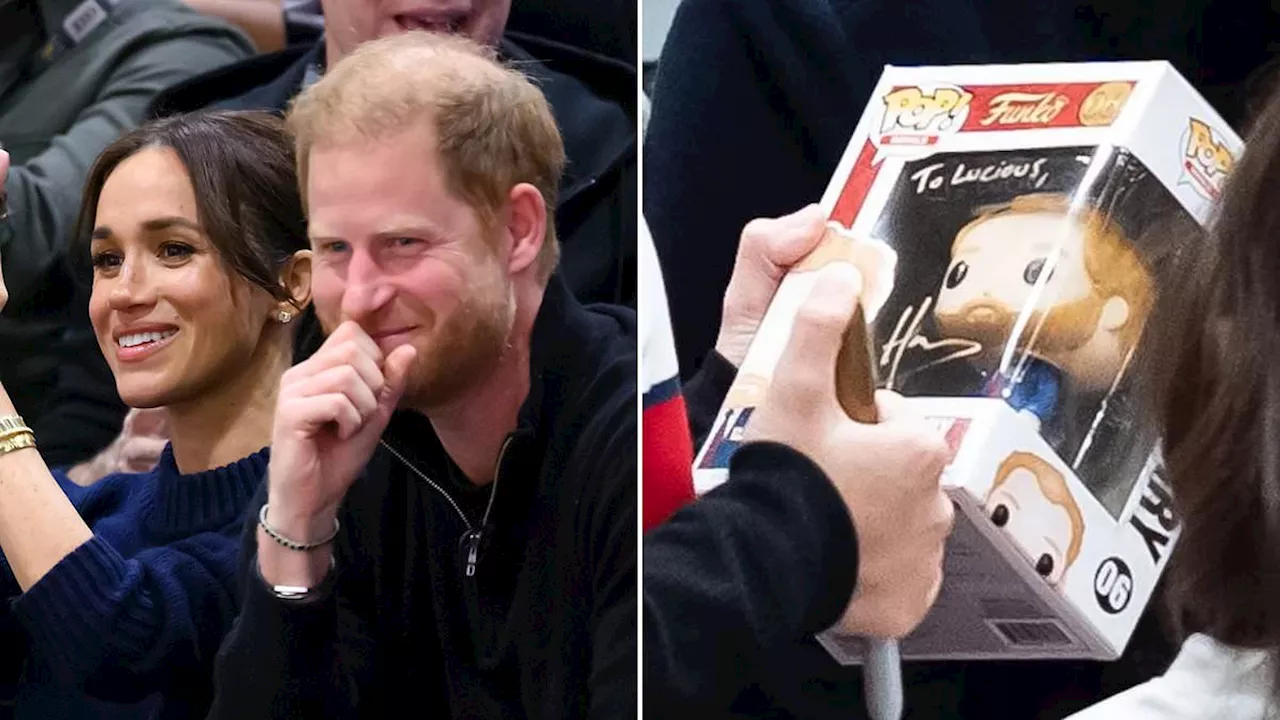 Prince Harry delights young fan by signing a toy version of himself at the Invictus Games