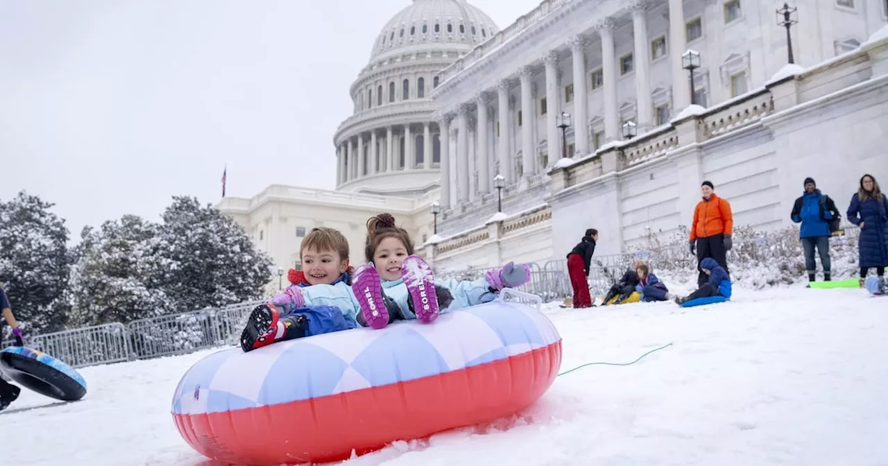 Children Sled Down Hill at Capitol After Snowstorm