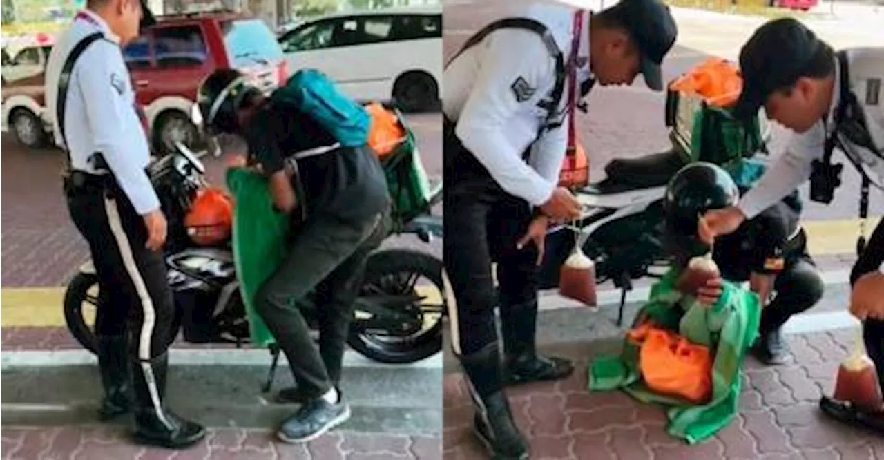 M’sian food delivery rider hands out drinks to traffic police