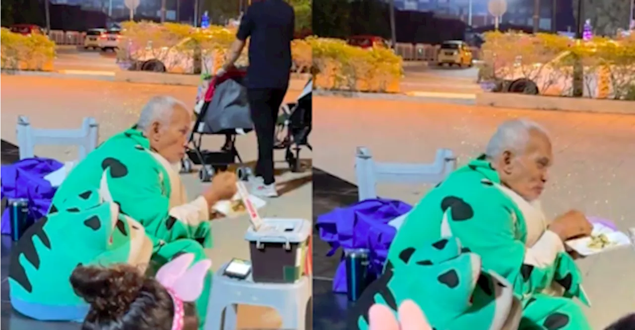 Elderly Man in Frog Mascot Costume Eating Late Meal Touches Malaysians' Hearts