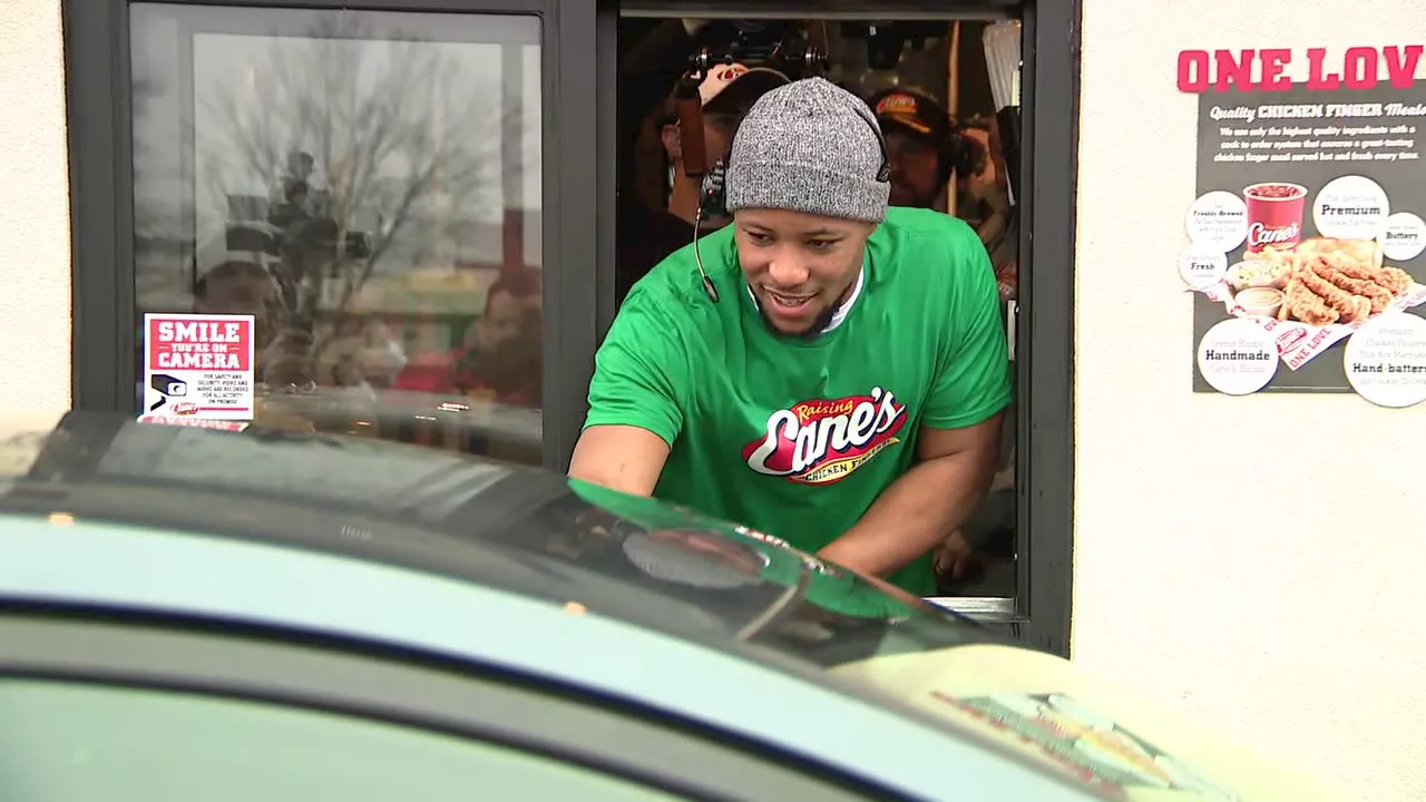 Saquon Barkley Dishes Out Smiles (and Chicken Fingers) at Raising Cane's During Super Bowl Victory Tour