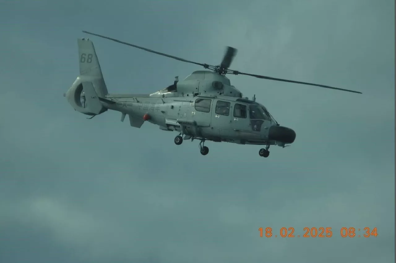 Chinese military helicopter in near miss with Philippine plane in South China Sea