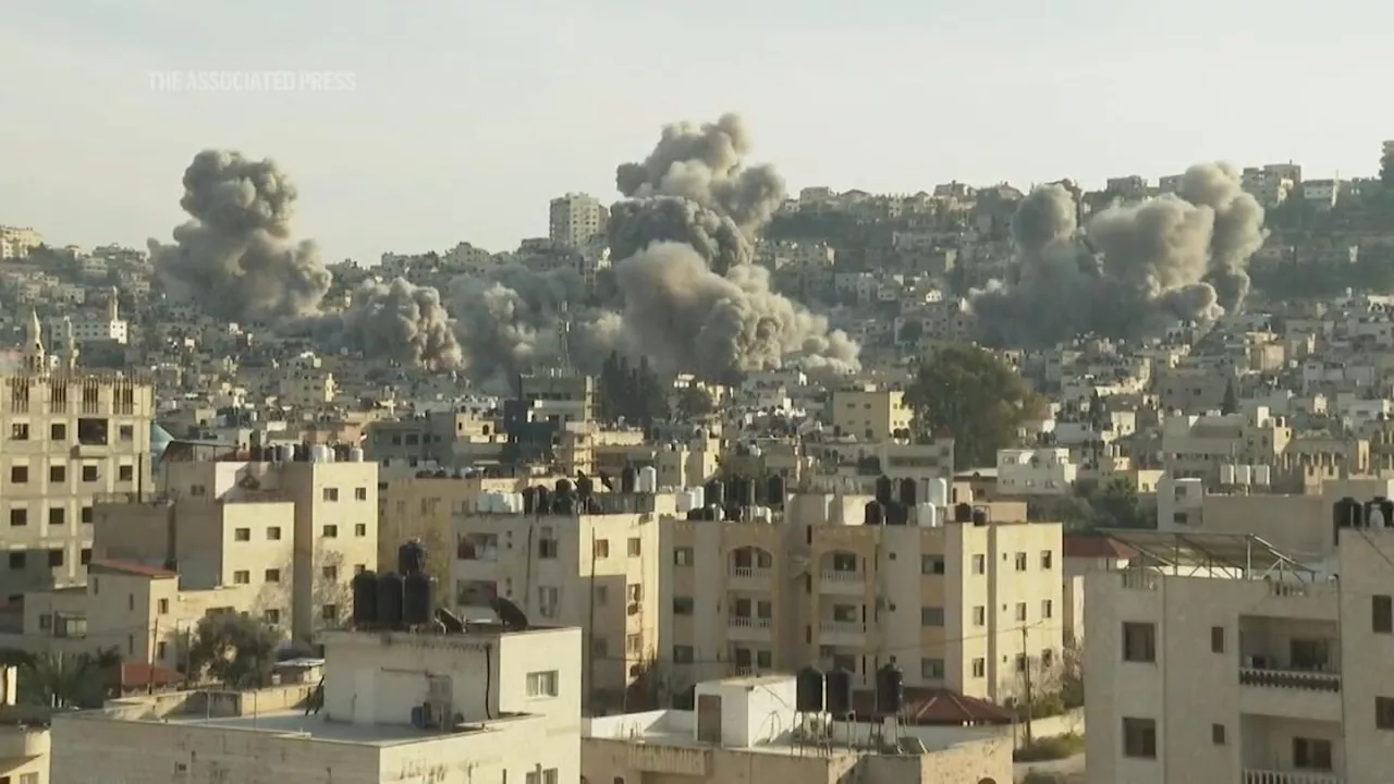 Large explosions in West Bank as Israeli army says it detonated buildings used by militants