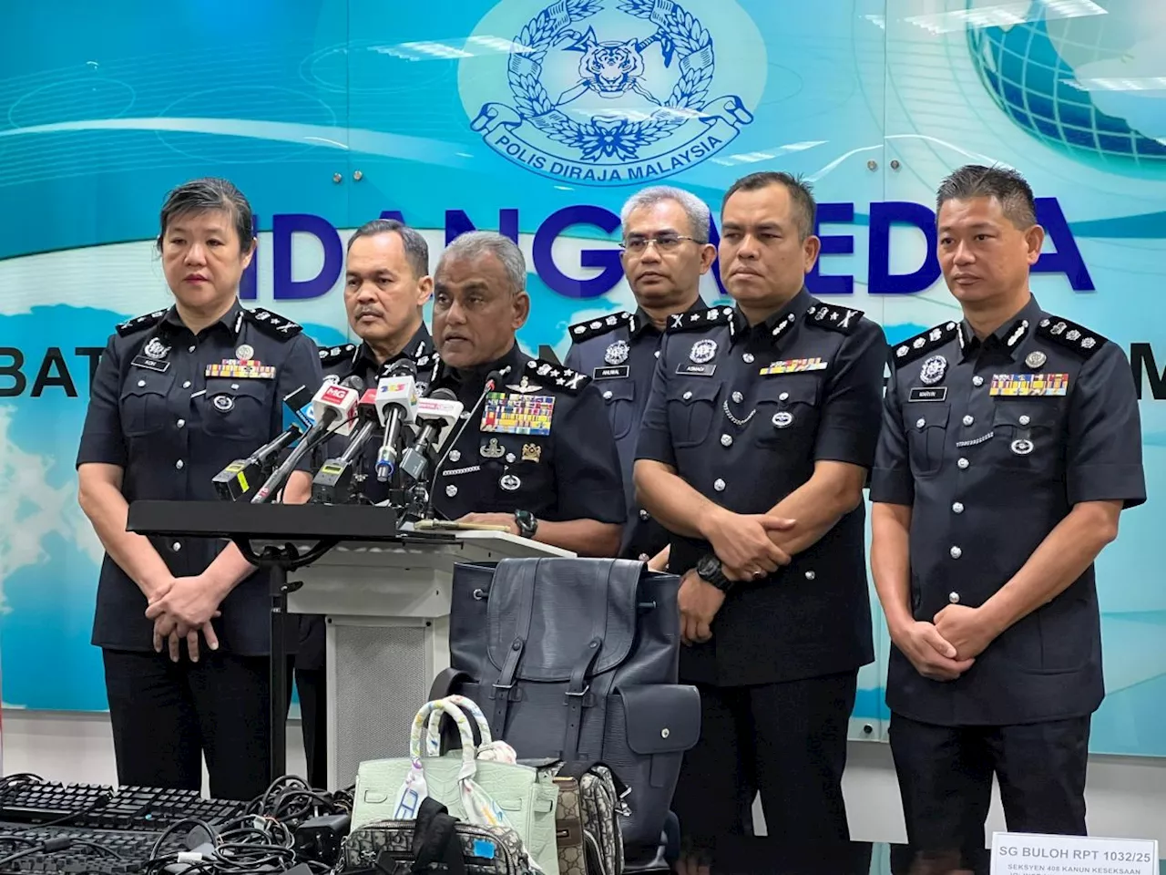 International scam syndicate busted, 14 arrested in raids on condo units