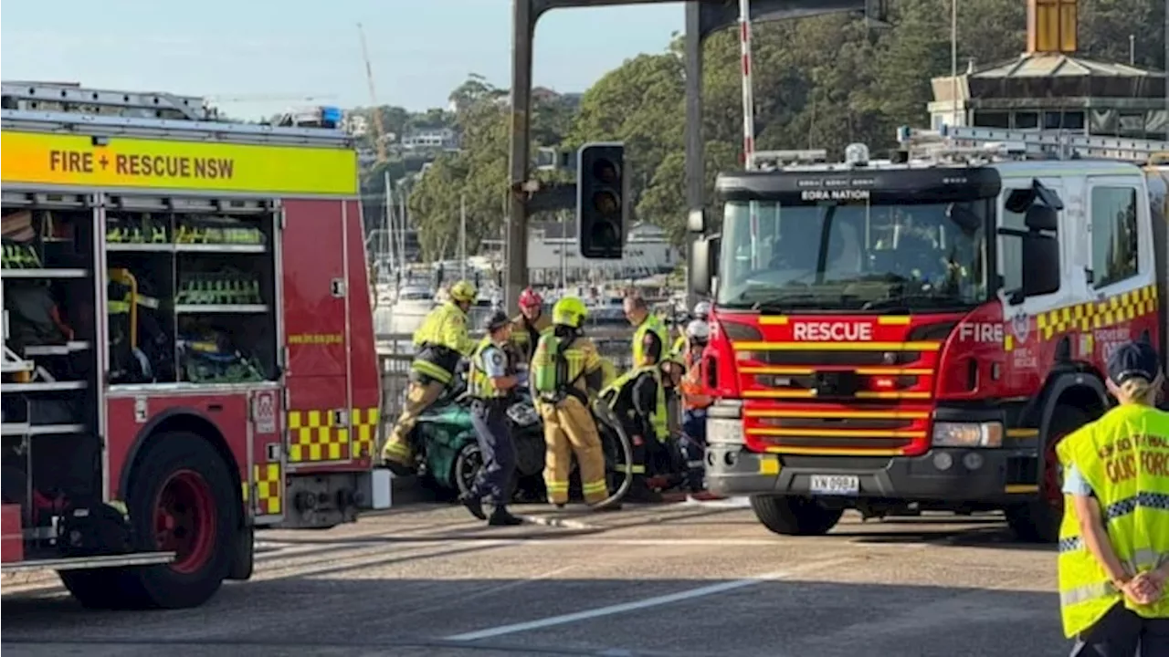 Major delays for commuters in Sydney’s north after car collides with truck
