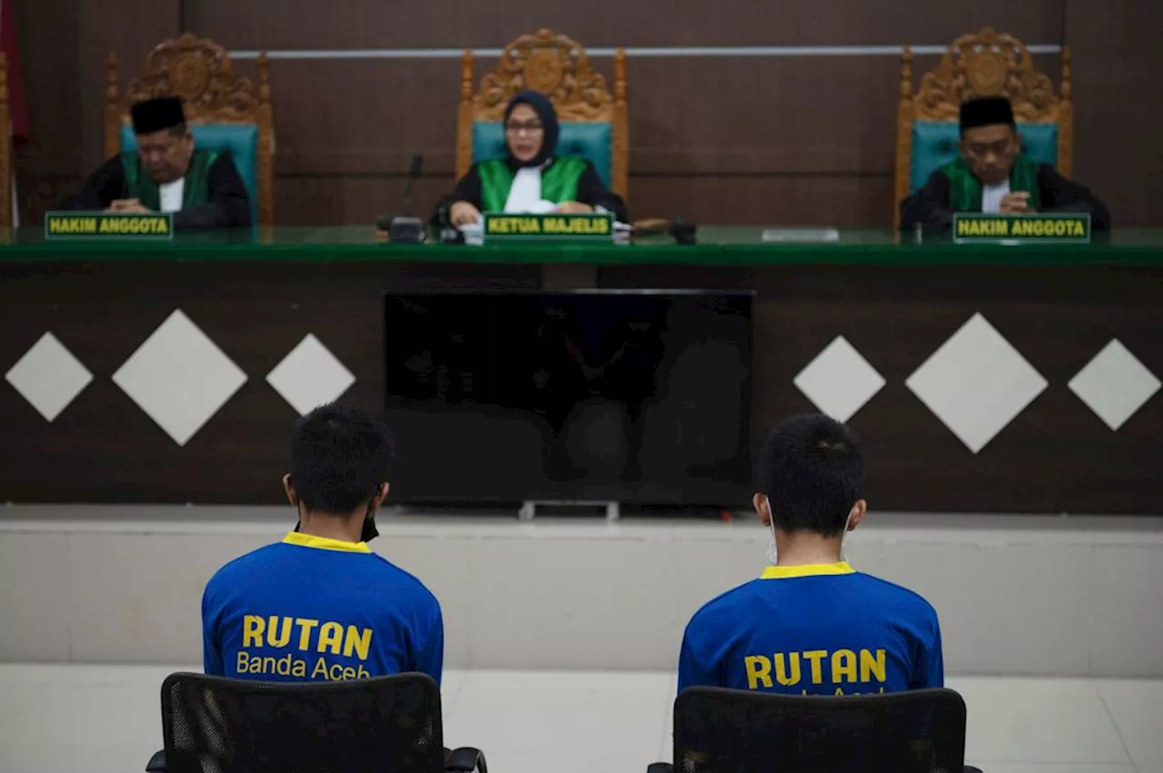 Shariah court in Indonesia sentences 2 men to up to 85 lashes for having gay sex