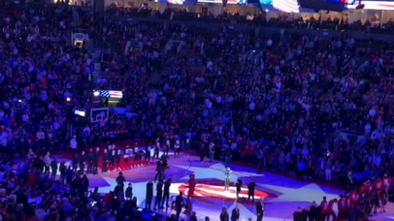 Fans at a Toronto Raptors game boo the American national anthem