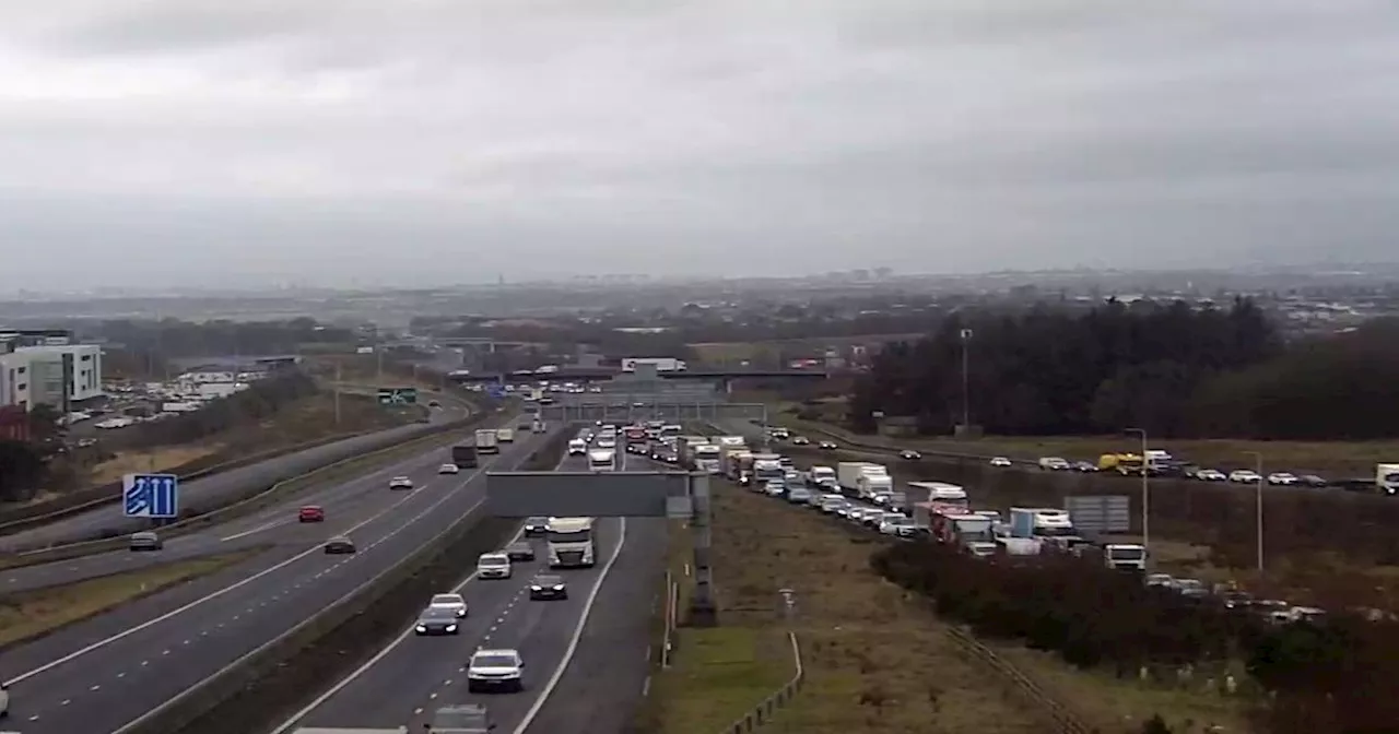 Hunt for 'man with potential weapon' as police seal off Lanarkshire M8 junction