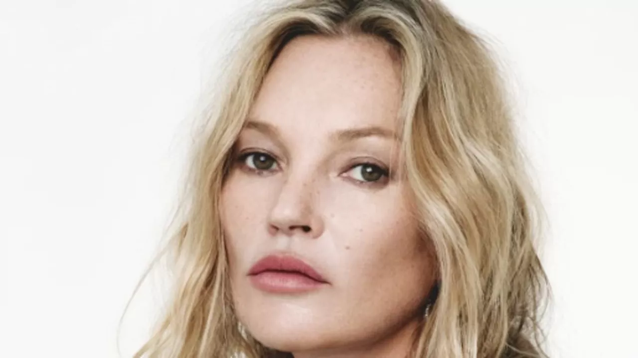 Kate Moss puts on a very leggy display in tiny black shorts as she showcases her supermodel...