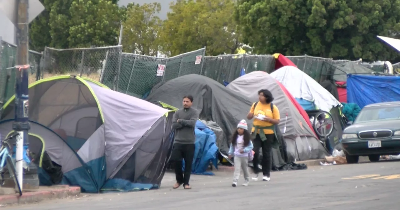 School Children Walk Past Homeless Encampments in Downtown San Diego