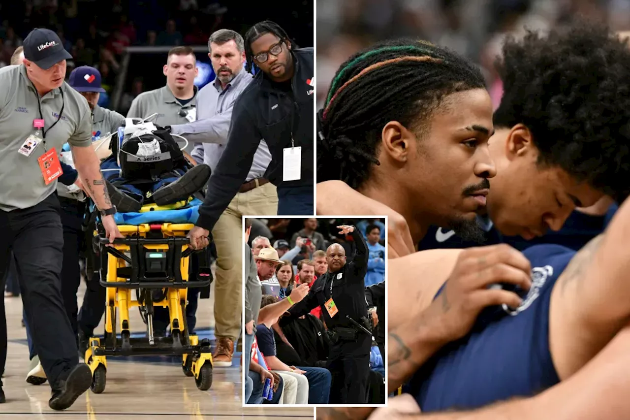 Fan stretchered off court in scary scene that delays Grizzlies-Spurs game