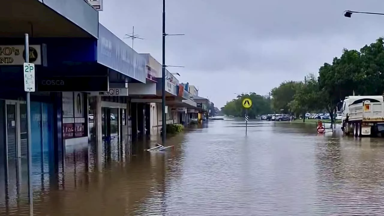 Second woman dies in Queensland floods as heatwave warnings remain