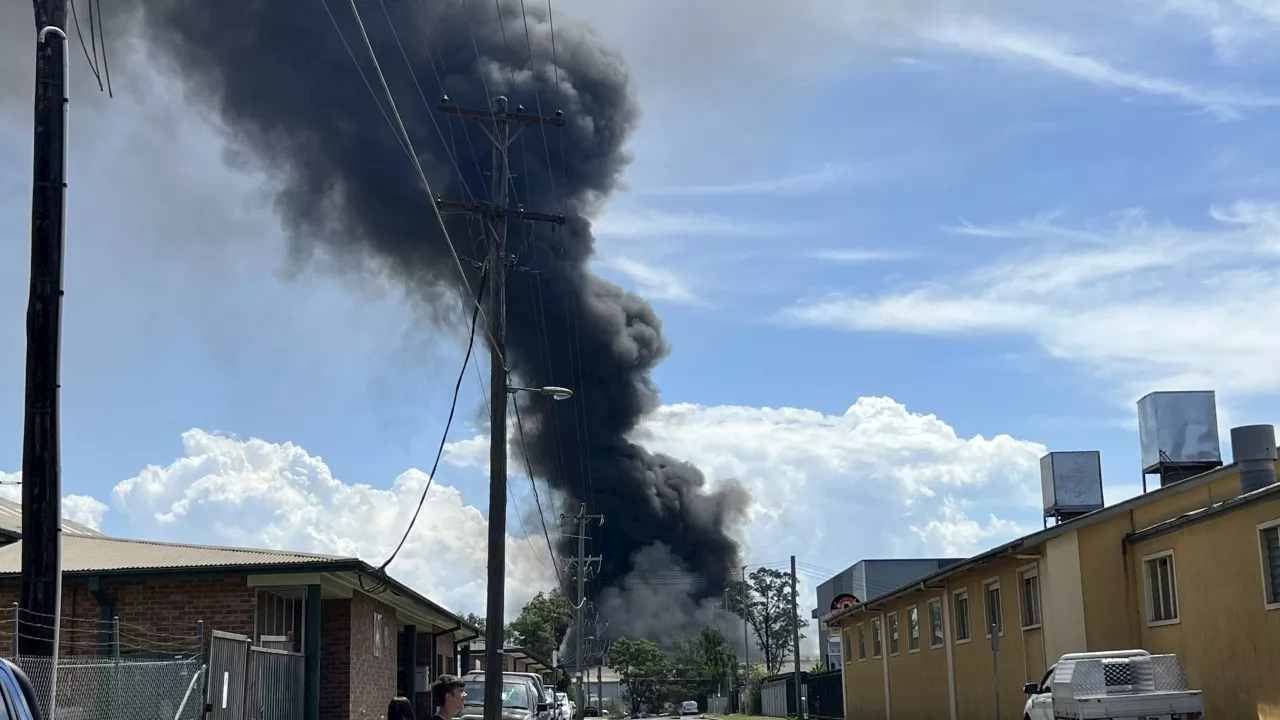 ‘Explosions’: Workers evacuate as factory fire erupts in Western Sydney