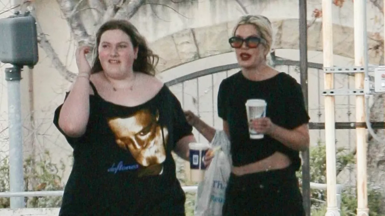 Tori Spelling and daughter Hattie, 13, coordinate in all-black clothing and stop for snacks at gas...