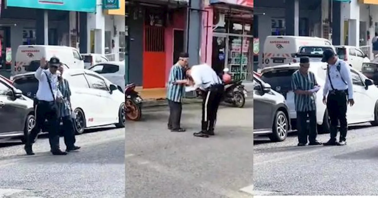 Malaysian Traffic Policeman Wins Praises for Helping Elderly Man Cross the Road