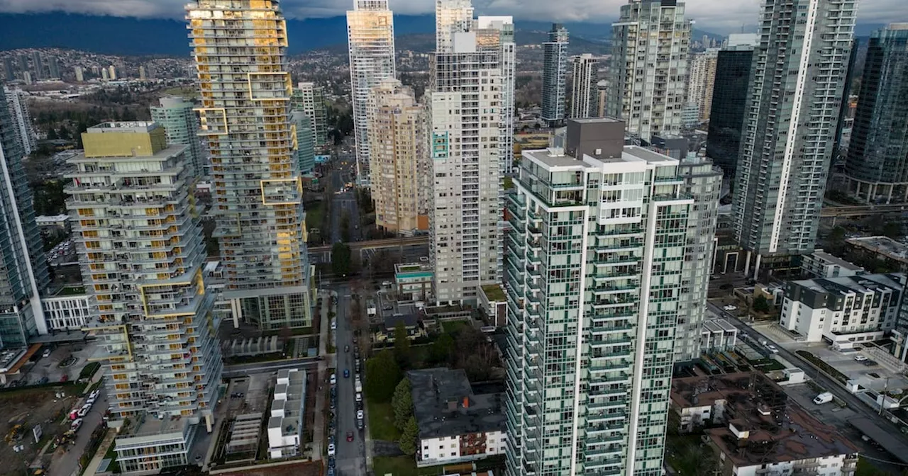 Condo buildings tower above older walk-up apartments in Burnaby, B.C.