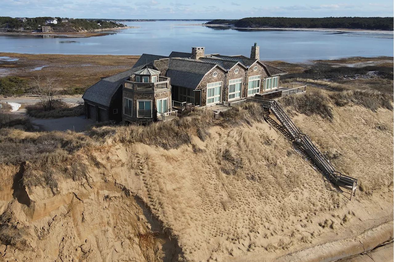 A luxury house is close to tumbling into Cape Cod Bay. Will anyone stop it?