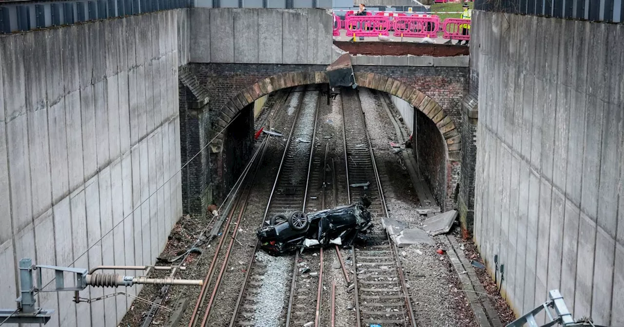 Live travel updates as car crashes at roundabout and lands on train track