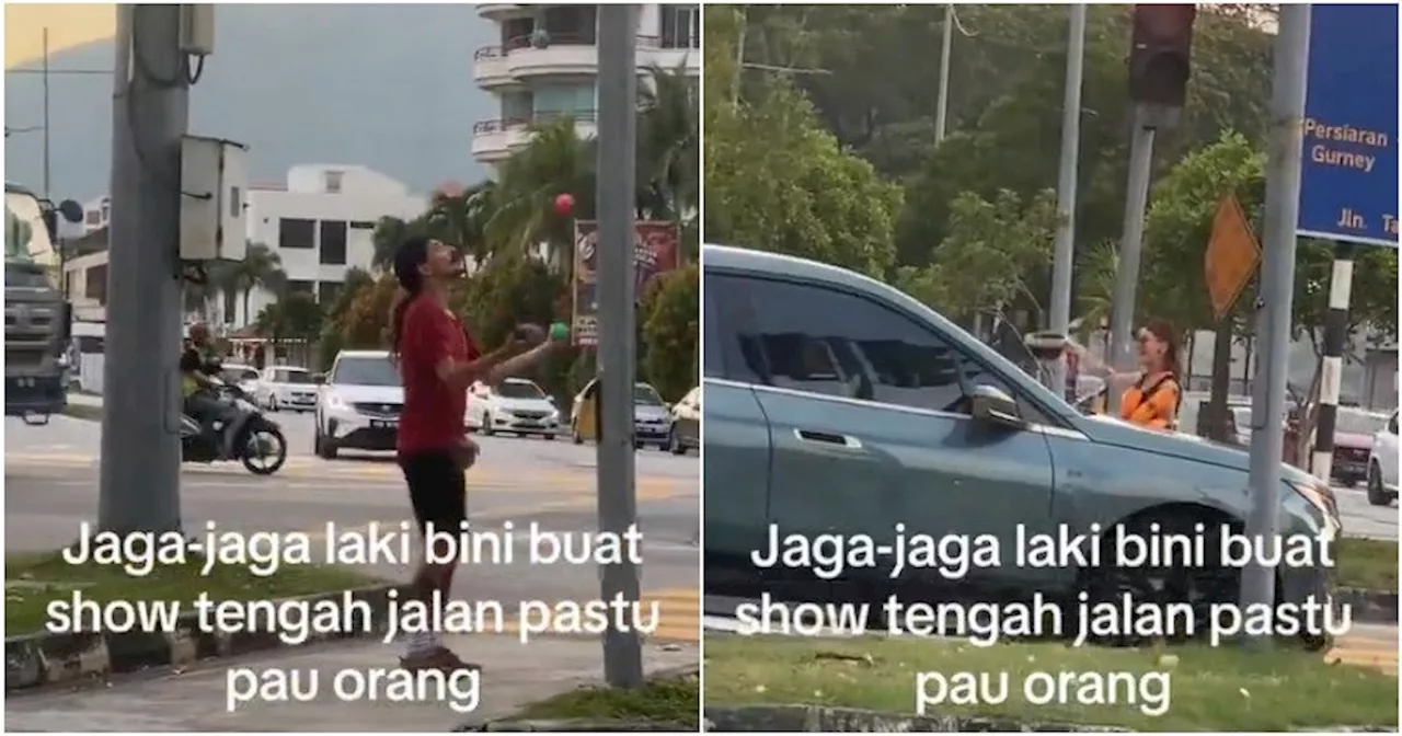 M'sians Slam Foreign Couple Seen Performing Stunts at Traffic Light Junction & Allegedly Asking for Money