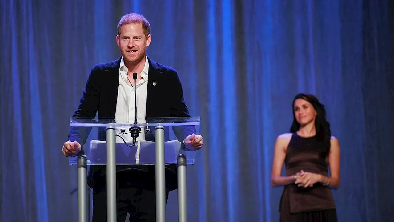 Meghan looks on lovingly as Prince Harry opens Invictus Games in front of whooping Vancouver crowd...