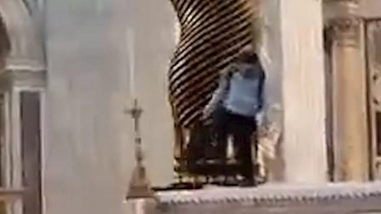 Moment masked thug attacks Saint Peter's tomb in front of horrified pilgrims in Vatican City before...