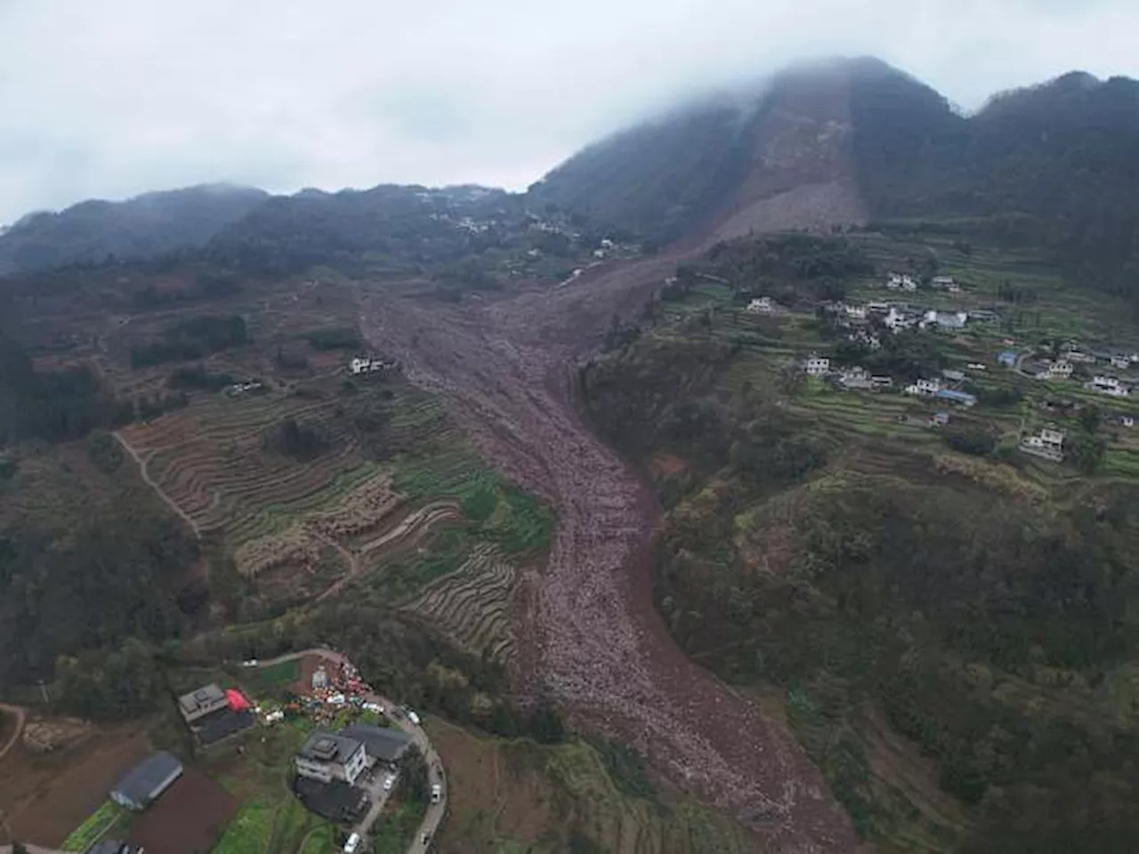 Rescuers search for some 30 people after a landslide in southwest China