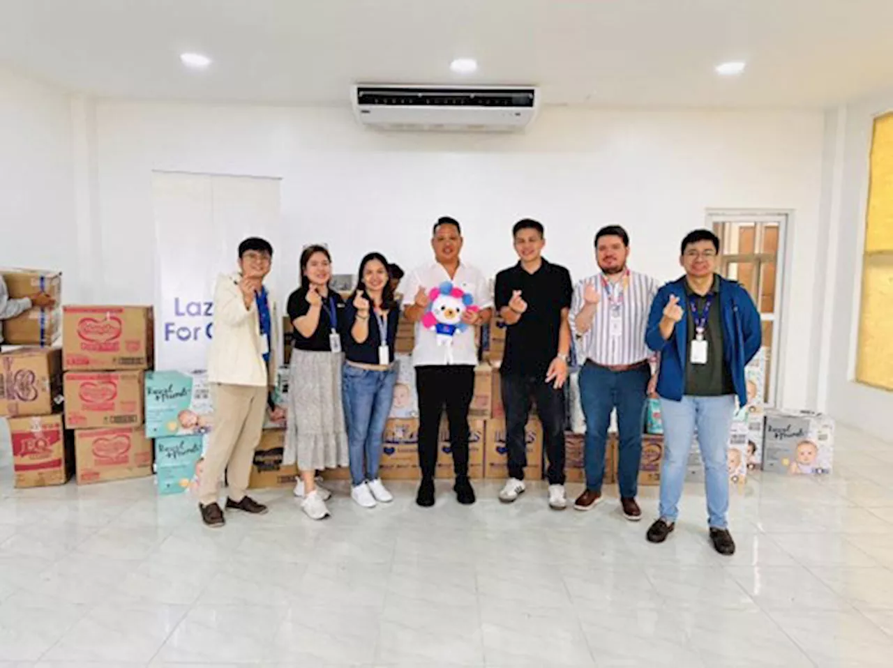 Lazada Philippines donates nearly 1,000 packs of baby diapers to typhoon relief efforts in Cabuyao, Laguna