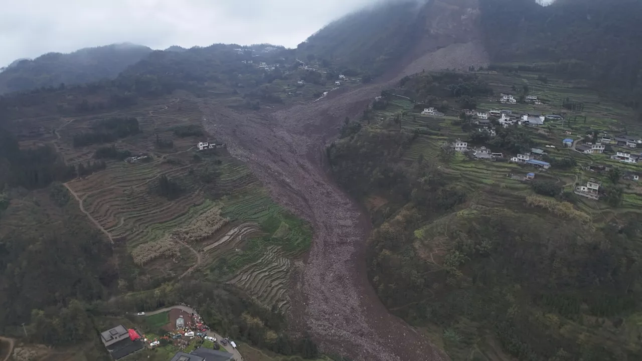 Rescuers search for at least 29 people after a landslide in southwest China