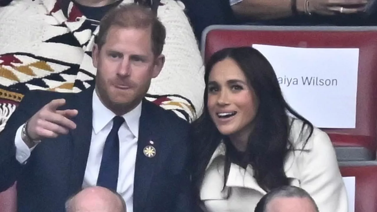 Meghan Markle and Prince Harry Snuggle Up at Invictus Games After Trump's Scathing Remarks