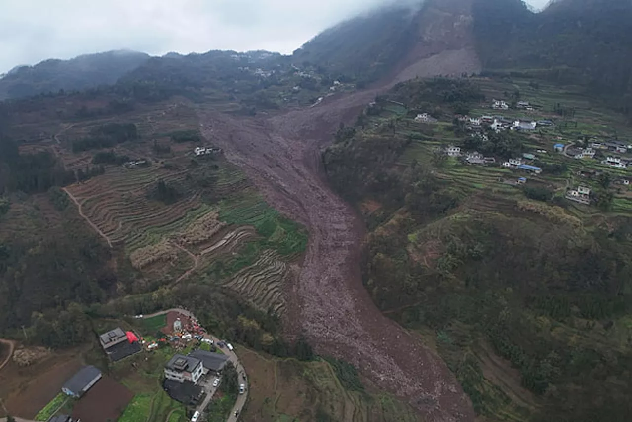 Rescuers search for at least 29 people after a landslide in southwest China