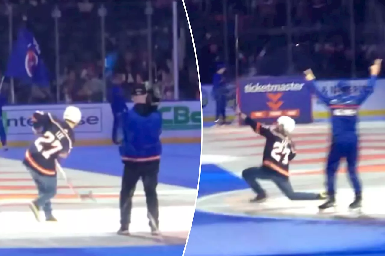 Islanders fan makes $1,000 shot from center ice in 'electric' moment