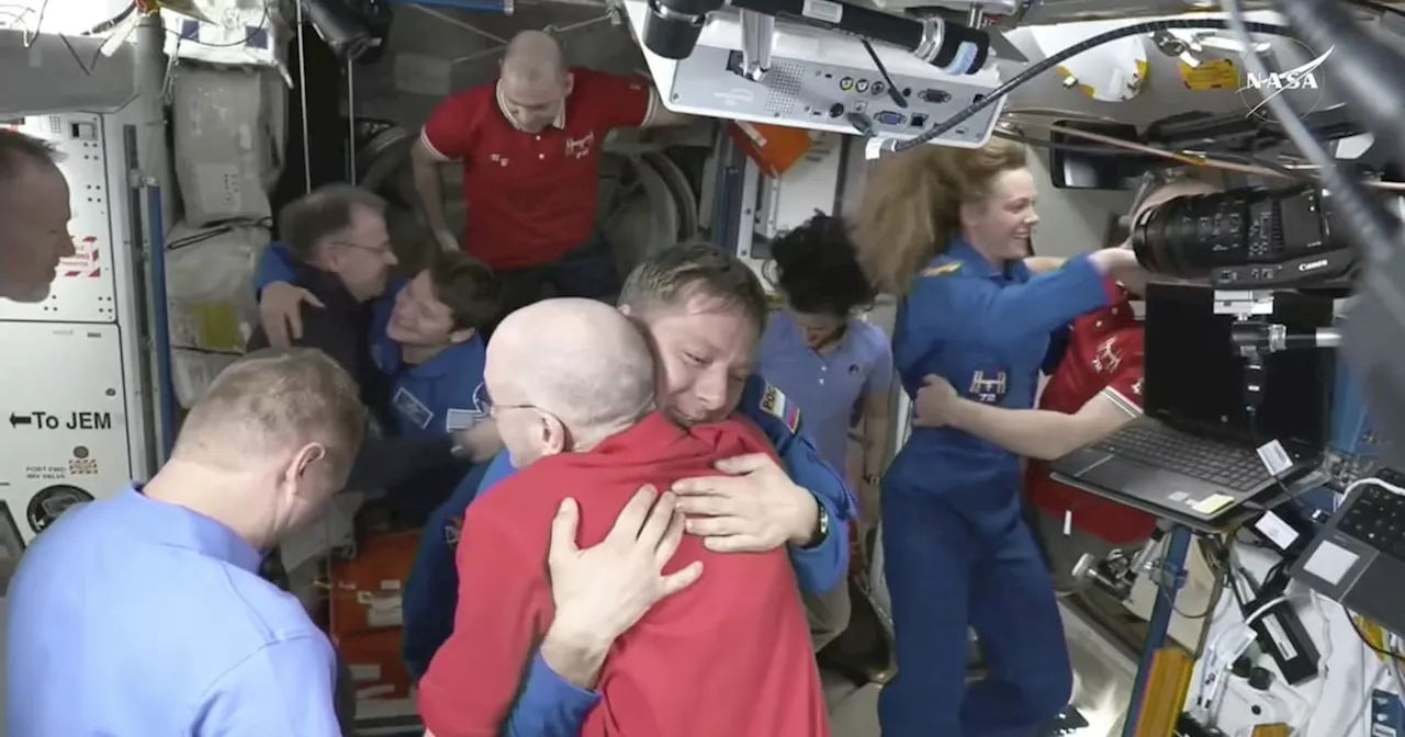 Astronauts Greet Each Other After SpaceX Capsule Docks with ISS