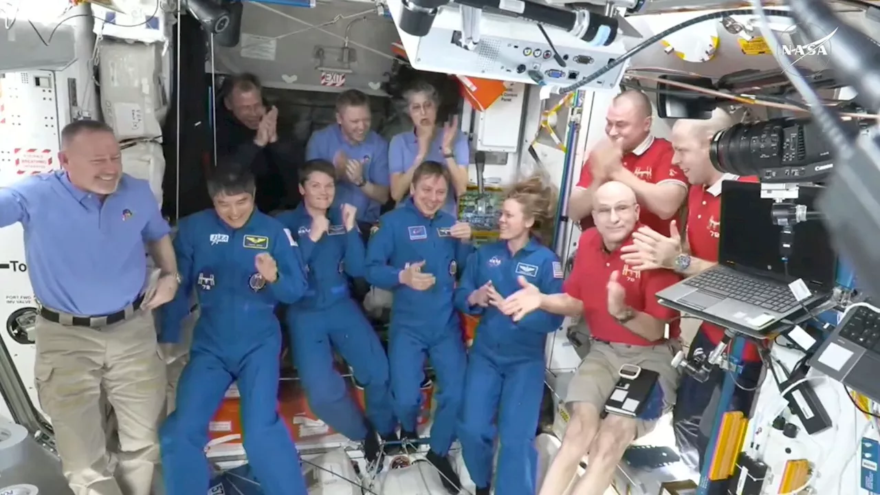 NASA's stuck astronauts welcome their newly arrived replacements to the space station