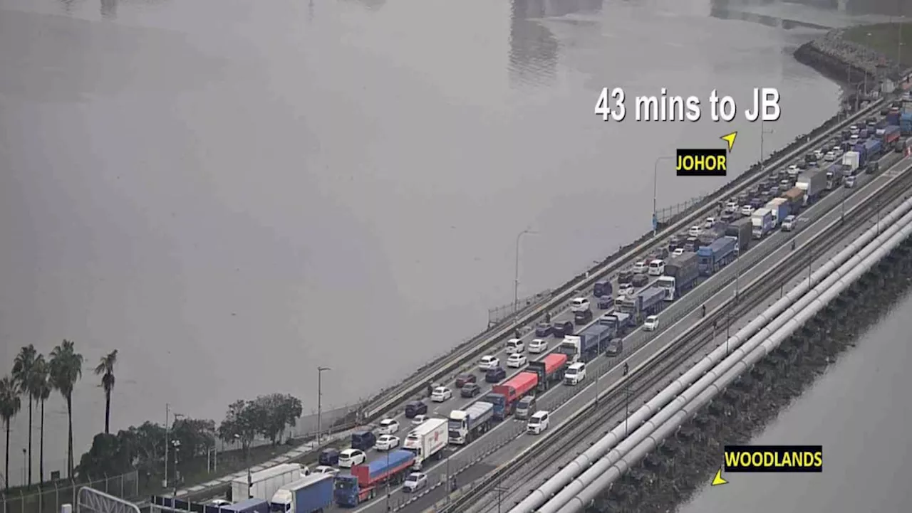 Travellers advised to defer non-essential travel to Johor as heavy rain worsens traffic at land checkpoints