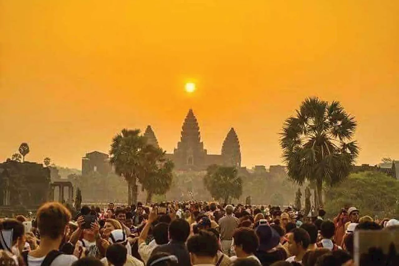 'Simply a rare sight', thousands of tourists gather at Cambodia's Angkor Wat to watch equinox sunrise