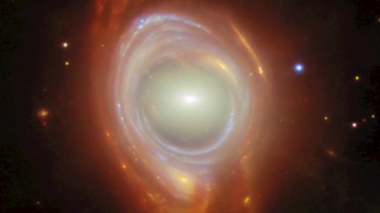 James Webb Space Telescope discovers 2 galaxies forming breathtaking 'cosmic lens': Space photo of the day