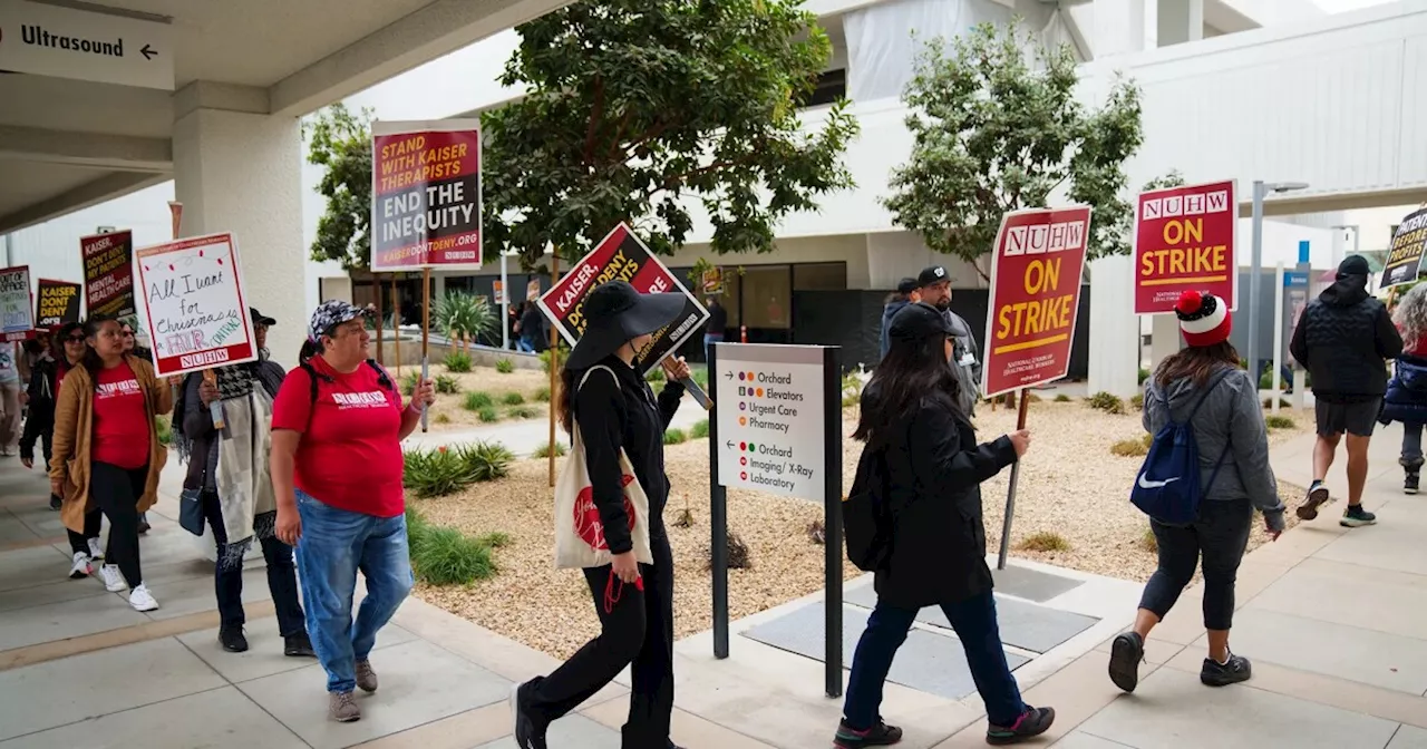A Kaiser strike by mental health workers drags on — setting a US record — as talks resume