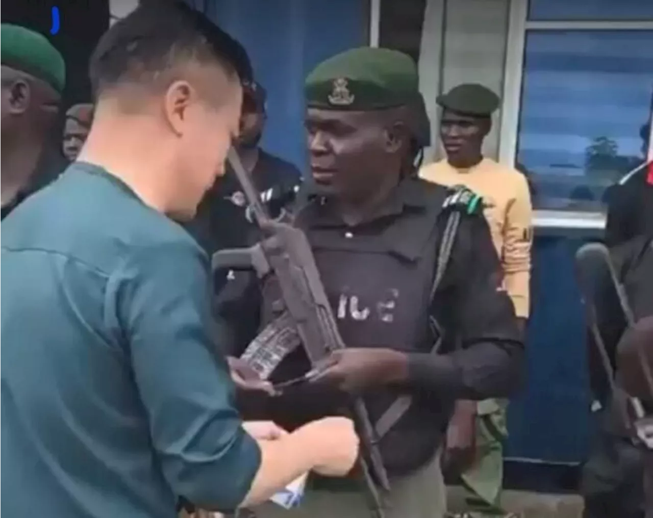 ‘Disgraceful’ — Nigerians react to video of Chinese nationals sharing N5,000 to police officers