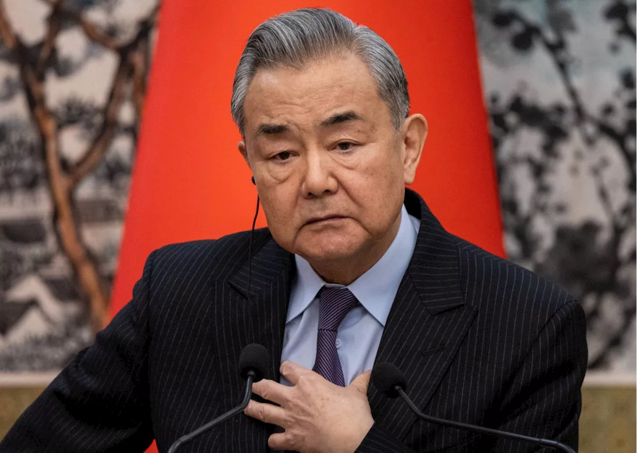 China FM Wang Yi calls on UK, EU to help defend global trade