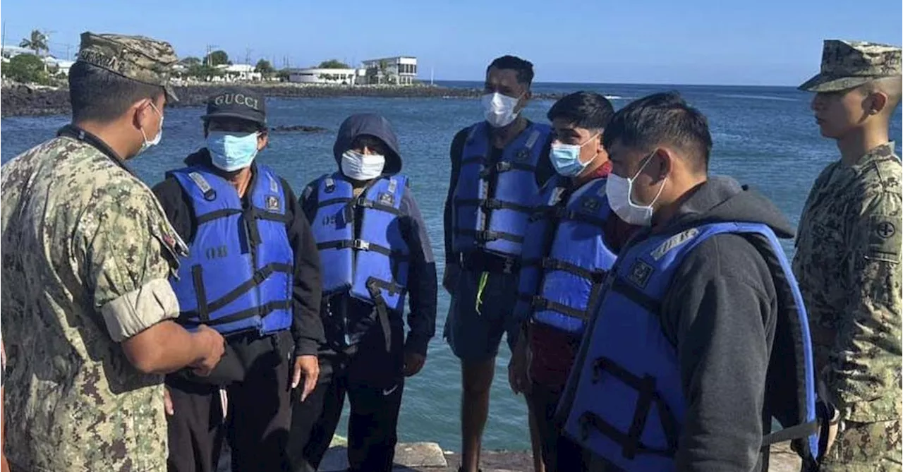 Five fishermen who spent 55 days adrift at sea arrive in the Galapagos Islands after rescue
