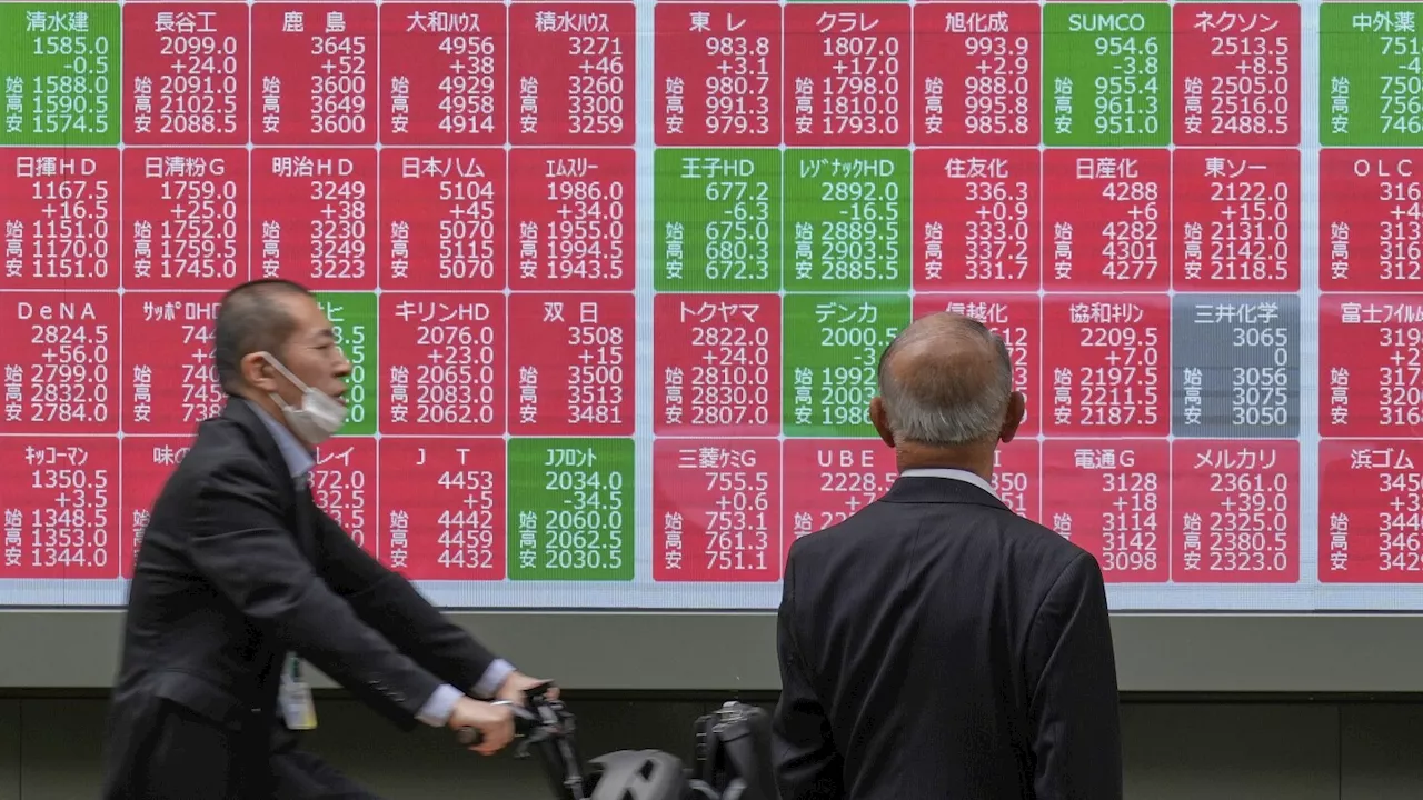 Asian shares dip as Japan's central bank hints at future rate hikes amid inflation
