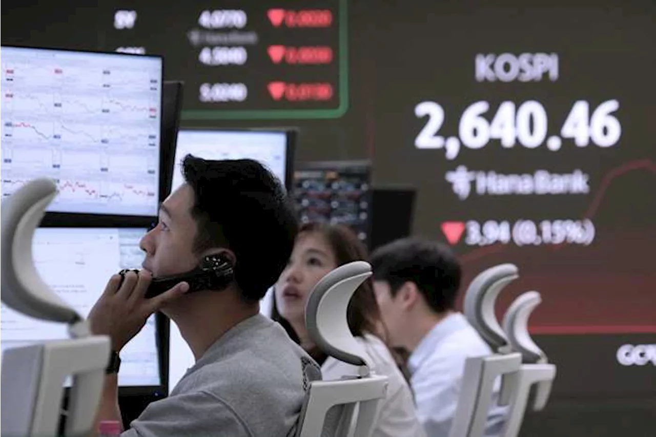 Asian shares mostly lower, trading in a narrow range with US markets closed for Memorial Day