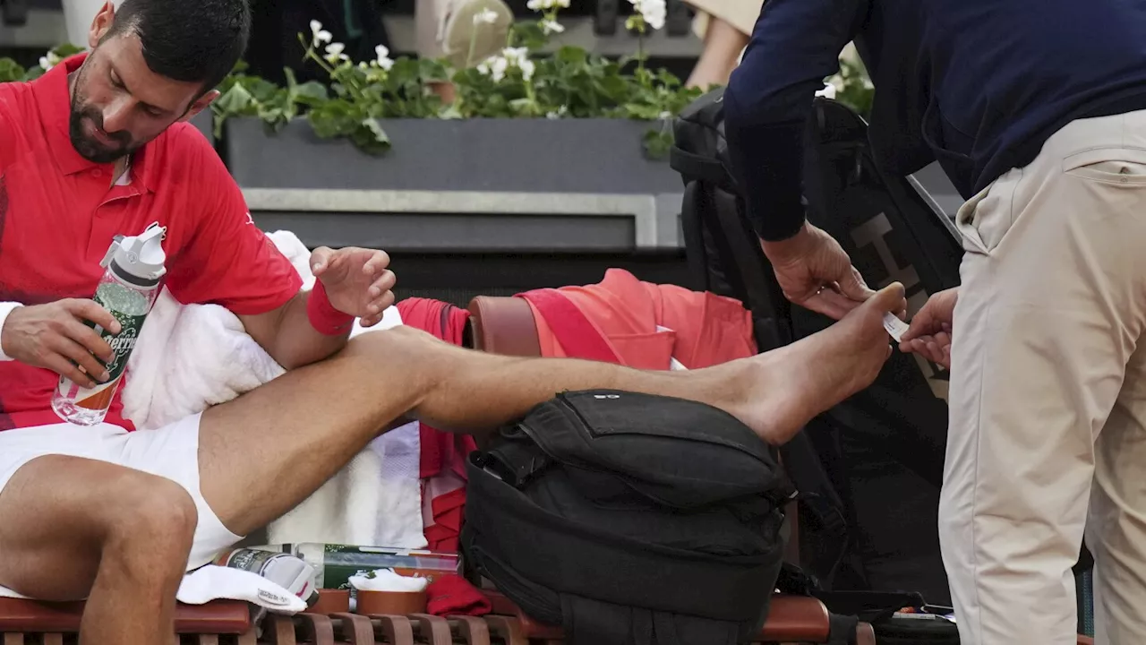 Novak Djokovic gets a toe taped up in French Open win