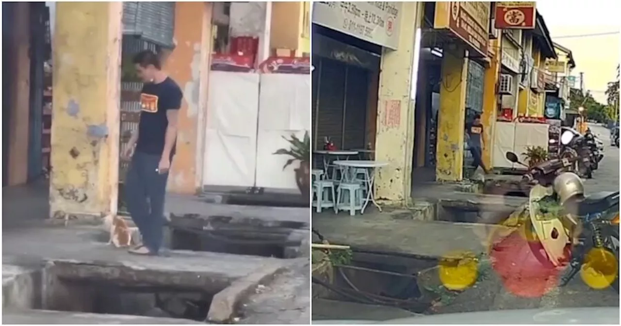 WATCH: Man Caught Kicking Stray Cat Into Drain Twice in Penang, M'sians Call for Justice