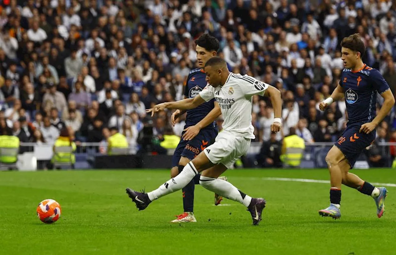 Soccer-Mbappe double helps Real win 3-2 over Celta Vigo to keep pressure on Barca