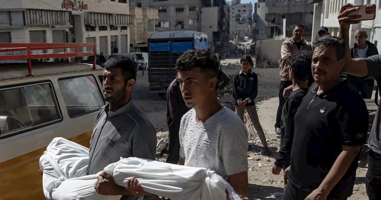 Israeli strikes on school housing displaced and on market kill 48 in Gaza, medics say