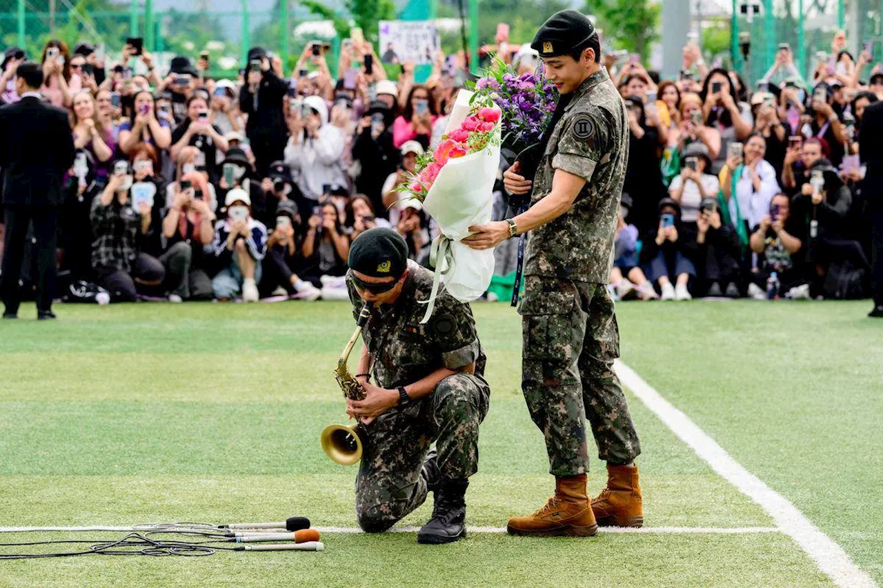 Two BTS megastars released from South Korea military