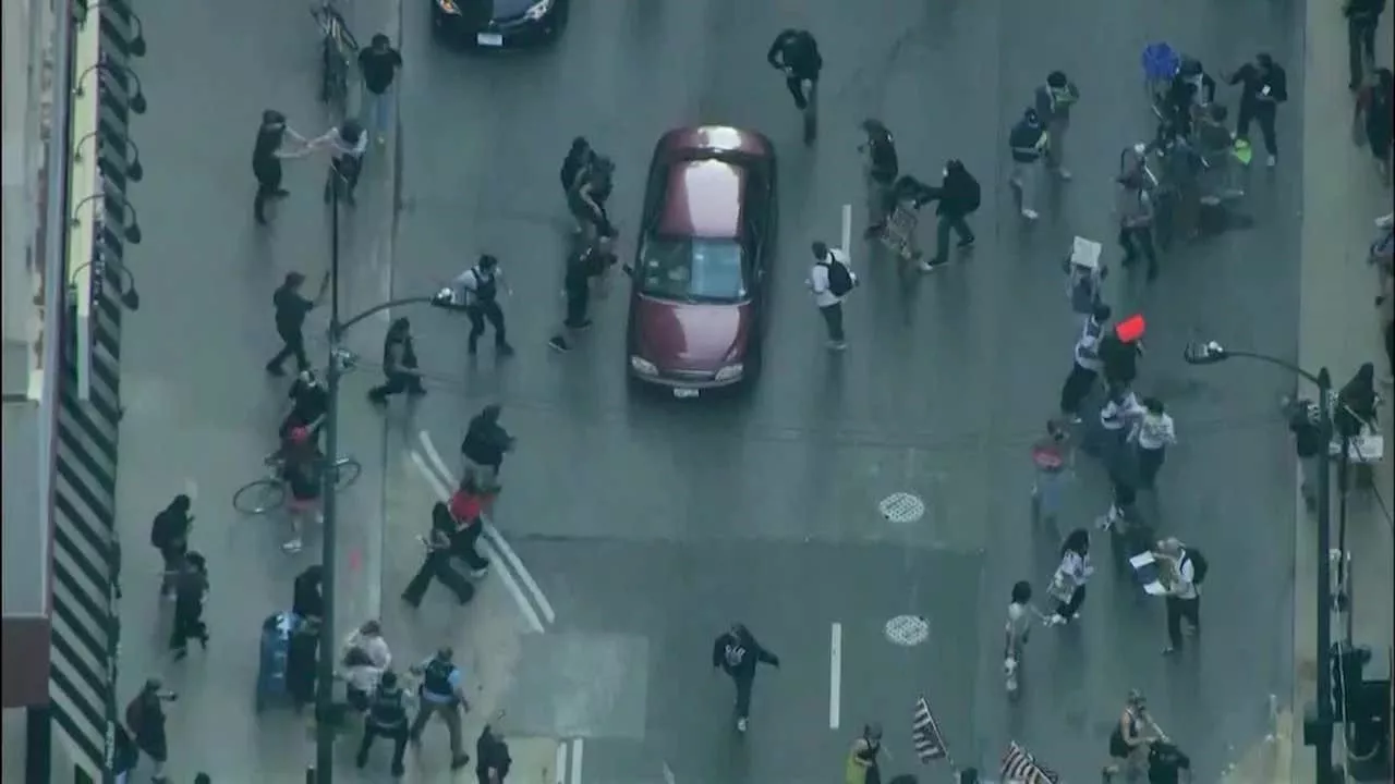 Chicago ICE protests: Woman hit by car that drove into crowd, police say