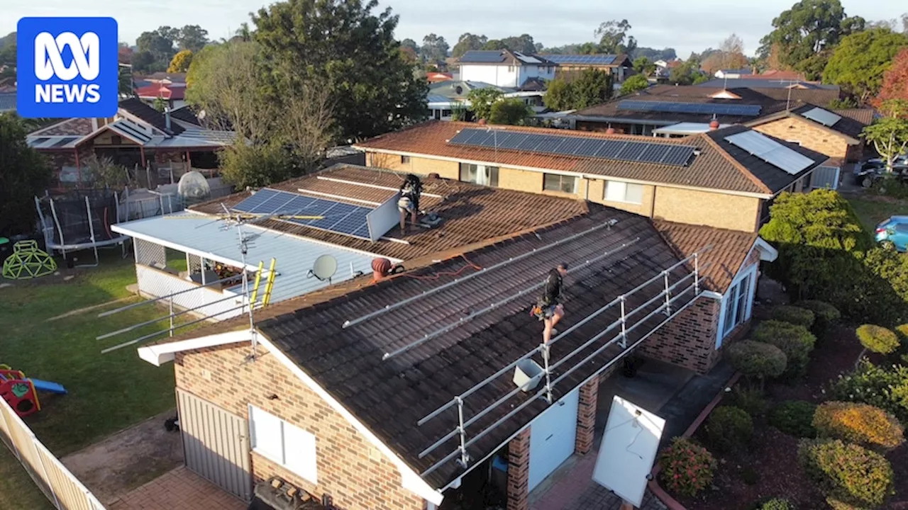 Solar waste problem looms following rooftop panel boom, with batteries to add to the pile