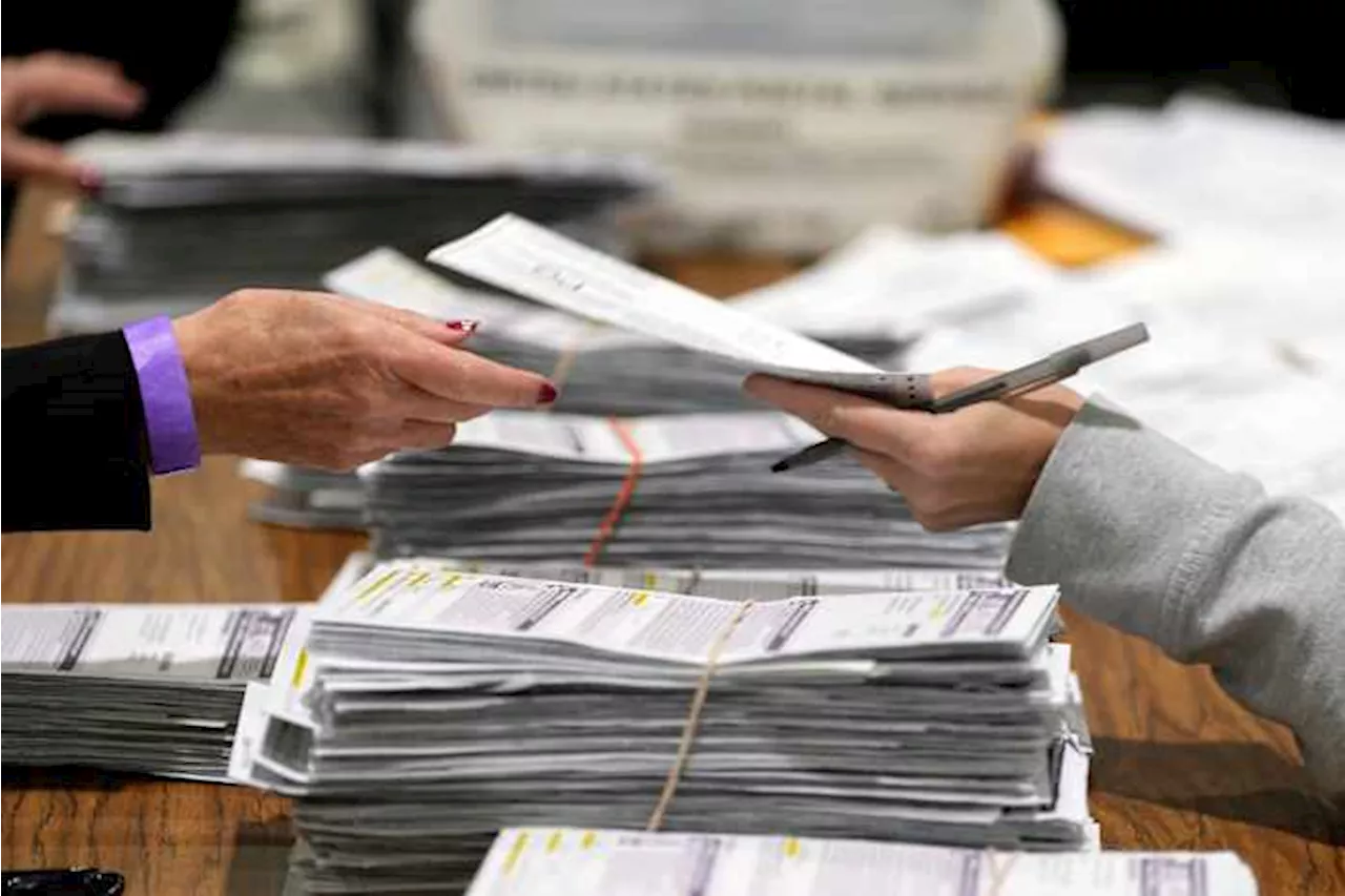 Justice Department's early moves on voting and elections signal a shift from its traditional role